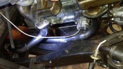 exhaust pipe routing next to engine